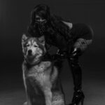 Domme Crouching with Dog