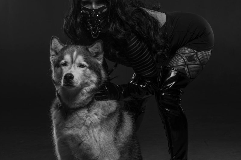 Domme Crouching with Dog