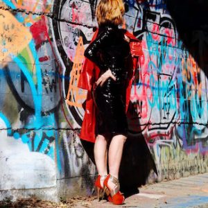 Dominatrix in PVC against Detroit graffiti